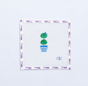 Needlepoint pattern with a green topiary tree in a blue pot on a white background