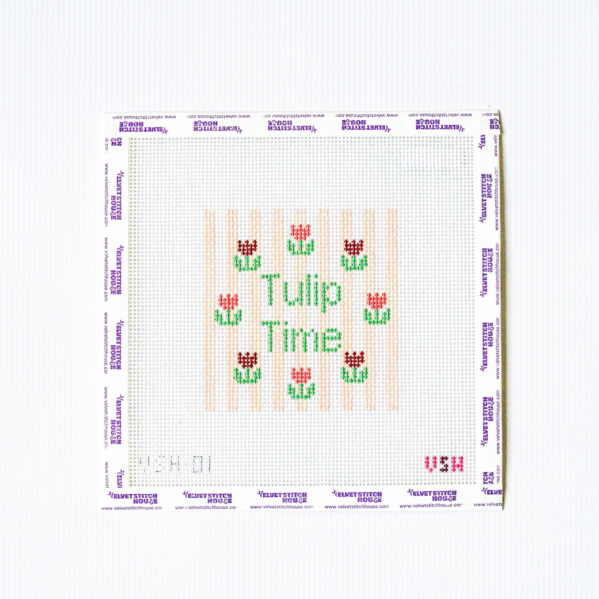 Needlepoint pattern with tulip design and 'Tulip Time' text on a white background