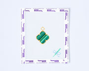 Needlepoint pattern with a green van cleef design on a white background