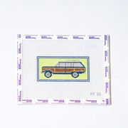 Needlepoint design of a vintage car on canvas with a white background