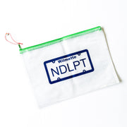 Clear pouch with green zipper featuring a license plate design on a white background Wilmette and NDLPT