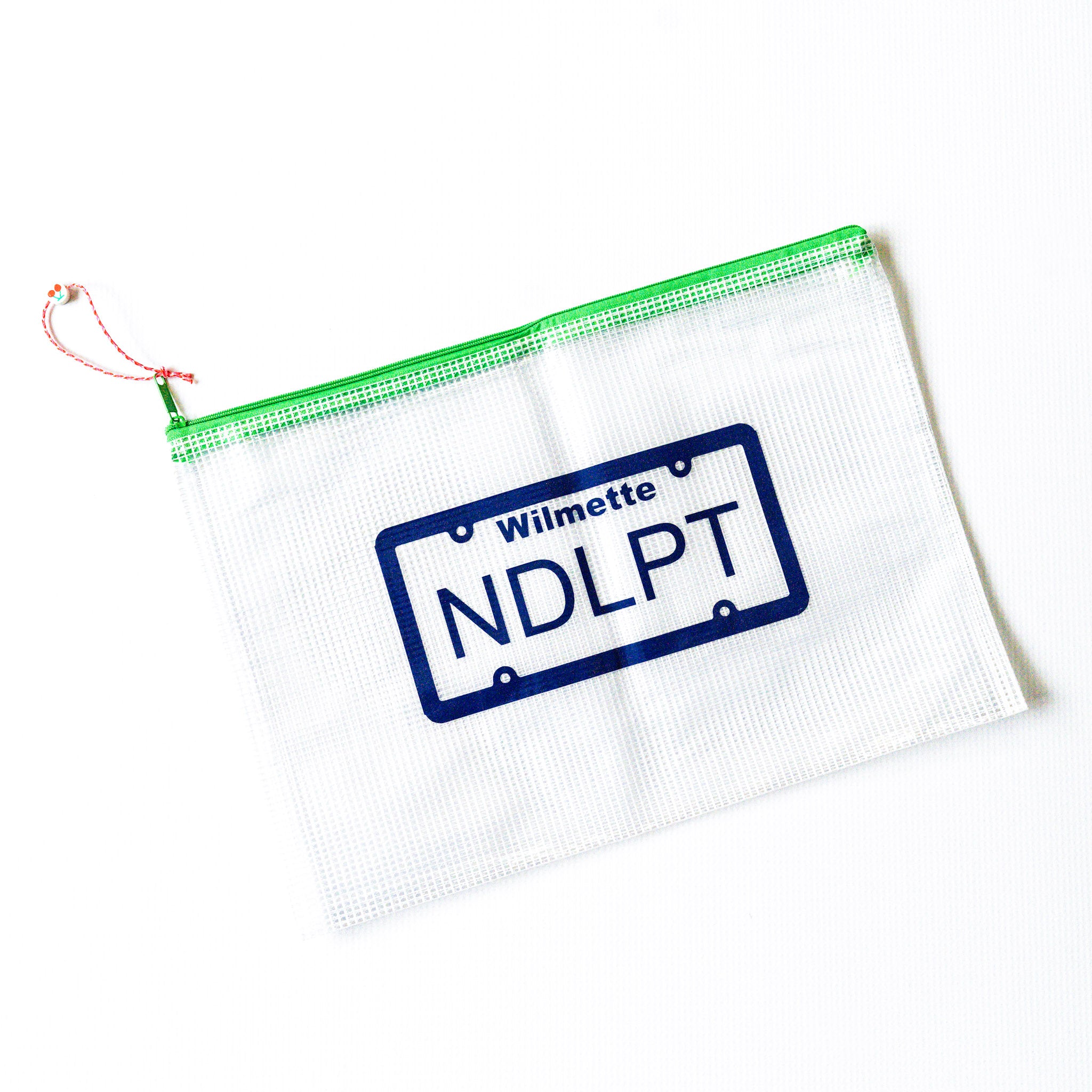 Clear pouch with green zipper featuring a license plate design on a white background Wilmette and NDLPT