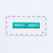 Needlepoint pattern key fob of a purple label displaying '60093' with yellow scallop edge.