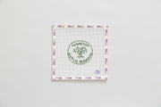 Needlepoint round design with 'Winnetka Public School' logo on a white background