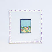 Needlepoint pattern of a coastal scene on a light blue background