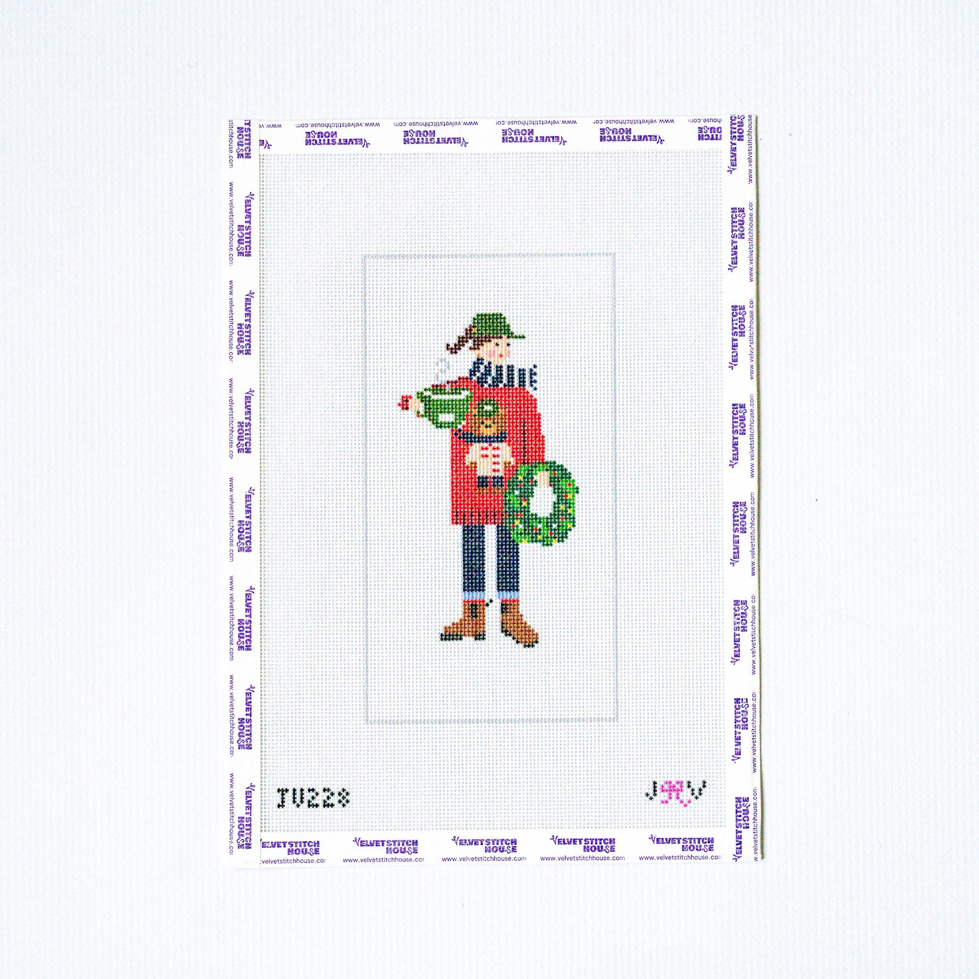 Needlepoint pattern with a person holding a wreath on a white background
